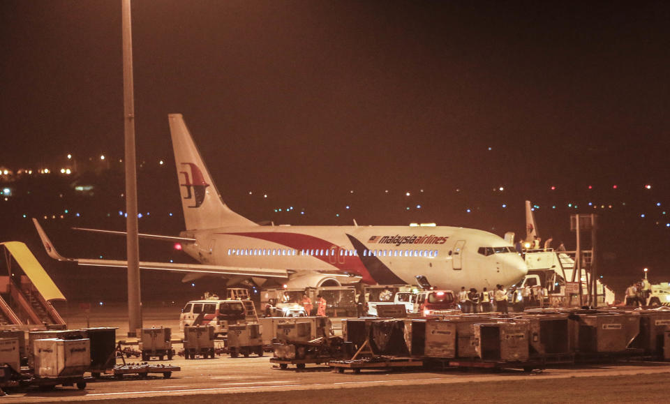 Malaysia Airlines flight MH192 bound for Bangalore turned back towards and parked at Kuala Lumpur International Airport in Sepang, Malaysia, Monday, April 21, 2014, after its right landing gear malfunctioned upon takeoff. The airline says Flight 192 carrying 166 people landed safely at the Kuala Lumpur International Airport early Monday, four hours after it departed. (AP Photo/Vincent Thian)