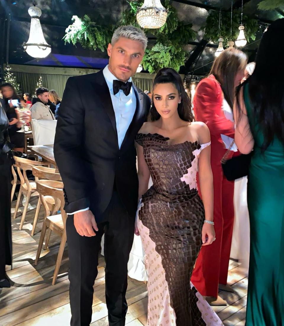 Kim rocked an off-the-shoulder, alligator skin gown and posed with hair stylist to the stars, Chris Appleton. 