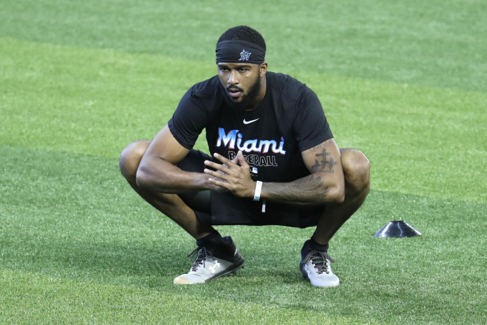 FILE - In this July 3, 2020, file photo, Miami Marlins starting pitcher Sandy Alcantara stretches during a baseball workout at Marlins Park in Miami. (AP Photo/Lynne Sladky, File)