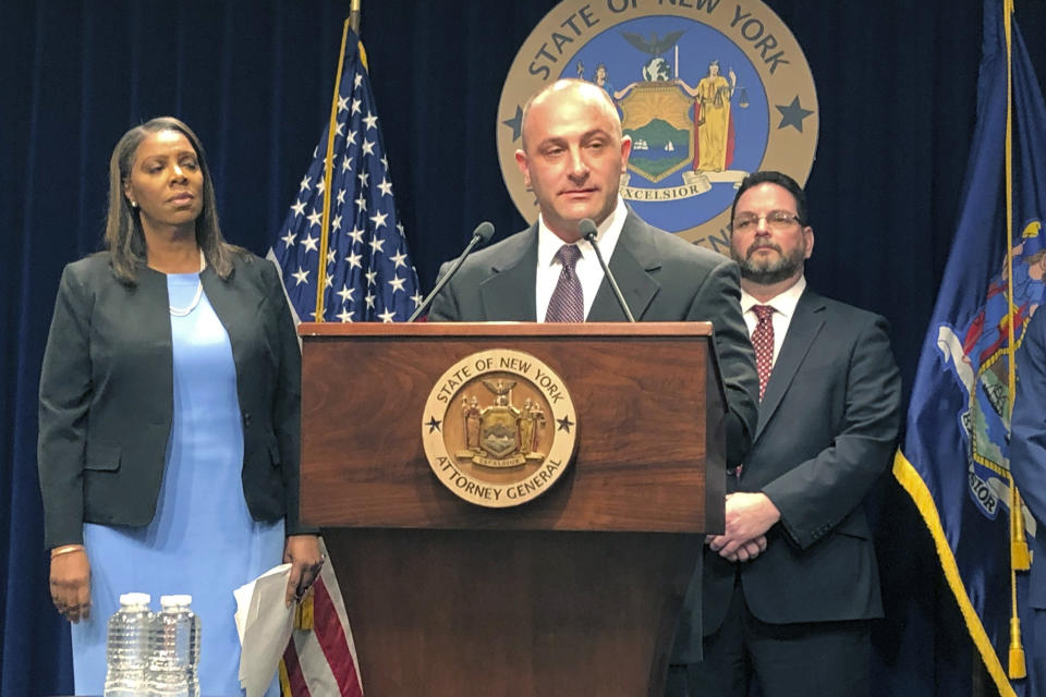 Justin Sangeorge, a social worker and recovering opioid addict, speaks at a news conference, Thursday, March 28, 2019, about a New York state lawsuit against opioid drug manufacturers and distributors. Behind him are New York Attorney General Letitia James, left, and drug abuse treatment center director Gary Butchen. New York on Thursday sued the billionaire family behind OxyContin, joining a growing list of state and local governments alleging the drugmaker sparked the nation's opioid crisis by putting hunger for profits over patient safety. (AP Photo/Jennifer Peltz)