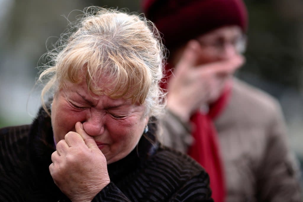 Women react during the funeral of Ukrainian army officer Vyacheslav Vyacheslavovych Dimov, who was killed on 16 April in battle in the Vasylivka district of Zaporizhzhia region (Reuters)