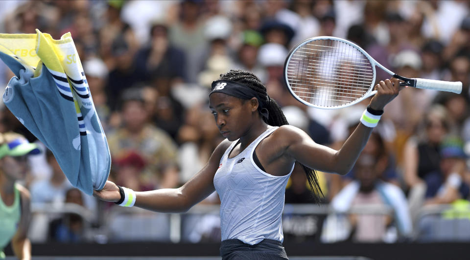 Coco Gauff of the U.S. reacts after losing a point to compatriot Sofia Kenin during their fourth round singles match at the Australian Open tennis championship in Melbourne, Australia, Sunday, Jan. 26, 2020. (AP Photo/Andy Brownbill)