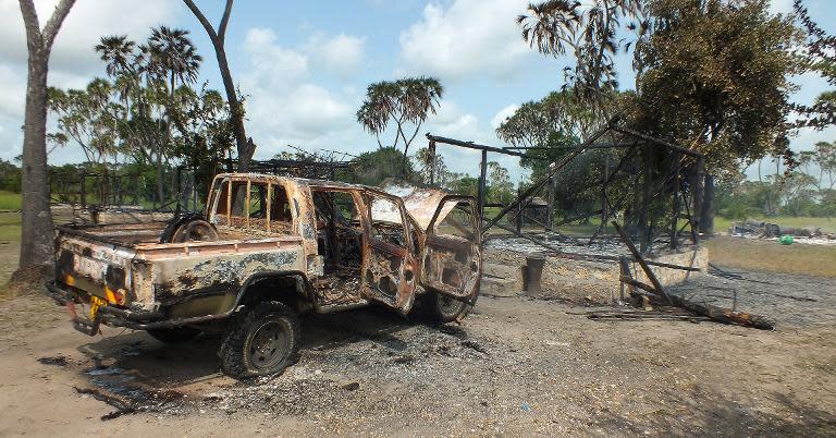 A photo taken on July 8, 2014 shows one of the torched offices and vehicles of the Lamu Conservation Trust, west of the Kenyan coastal town of Lamu