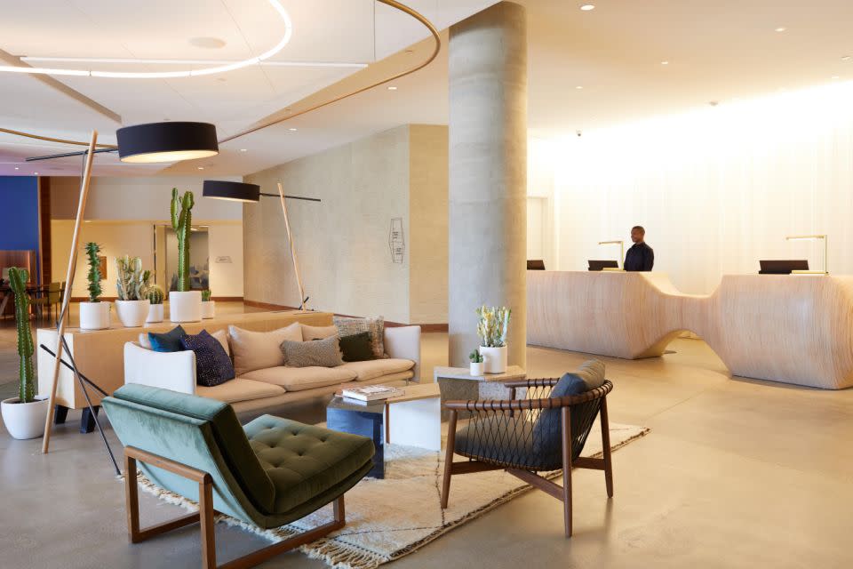 The huge wooden check in desks are the hero of the lobby. Photo: Supplied