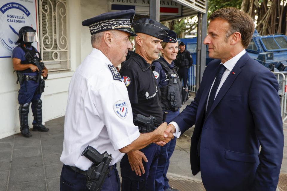 French President Emmanuel Macron visits the central police station in Noumea, New Caledonia, Thursday, May 23, 2024. Macron has met with local officials in riot-hit New Caledonia, after crossing the globe in a high-profile show of support for the French Pacific archipelago gripped by deadly unrest.(Ludovic Marin/Pool Photo via AP)