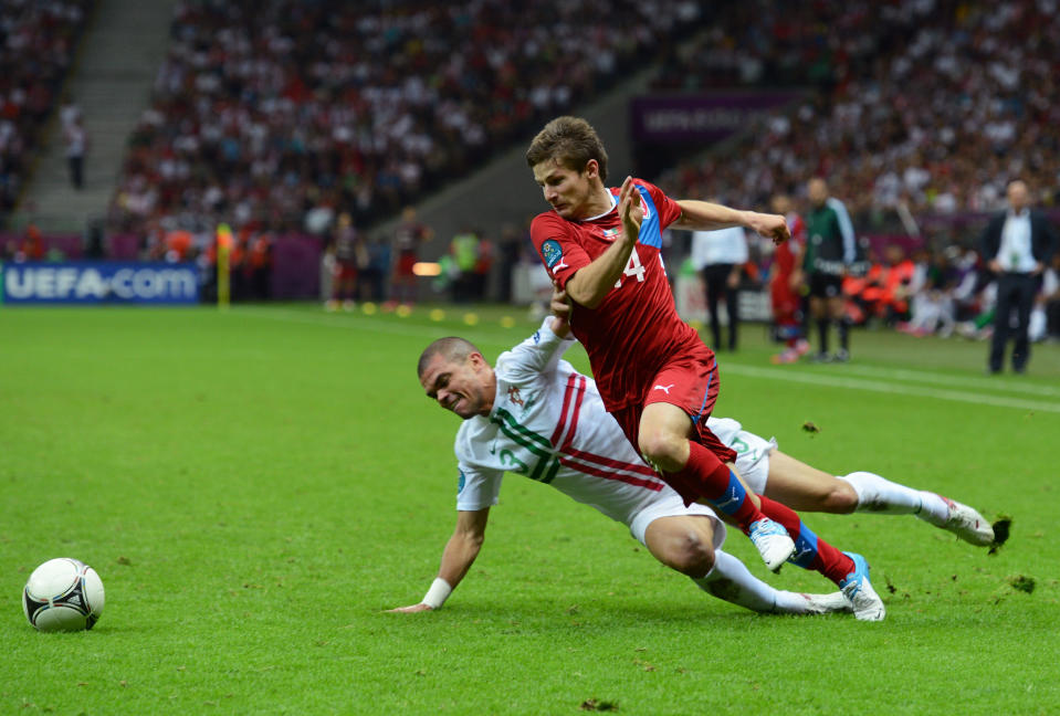 WARSAW, POLAND - JUNE 21: Vaclav Pilar of Czech Republic goes past the challenge from Pepe of Portugal during the UEFA EURO 2012 quarter final match between Czech Republic and Portugal at The National Stadium on June 21, 2012 in Warsaw, Poland. (Photo by Shaun Botterill/Getty Images)