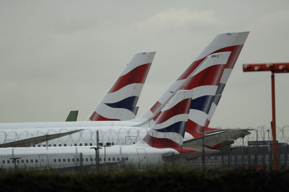 British Airways planes sit parked at Heathrow Airport in London, Monday, Sept. 9, 2019. British Airways says it has had to cancel almost all flights as a result of a pilots' 48-hour strike over pay. (AP Photo/Matt Dunham)