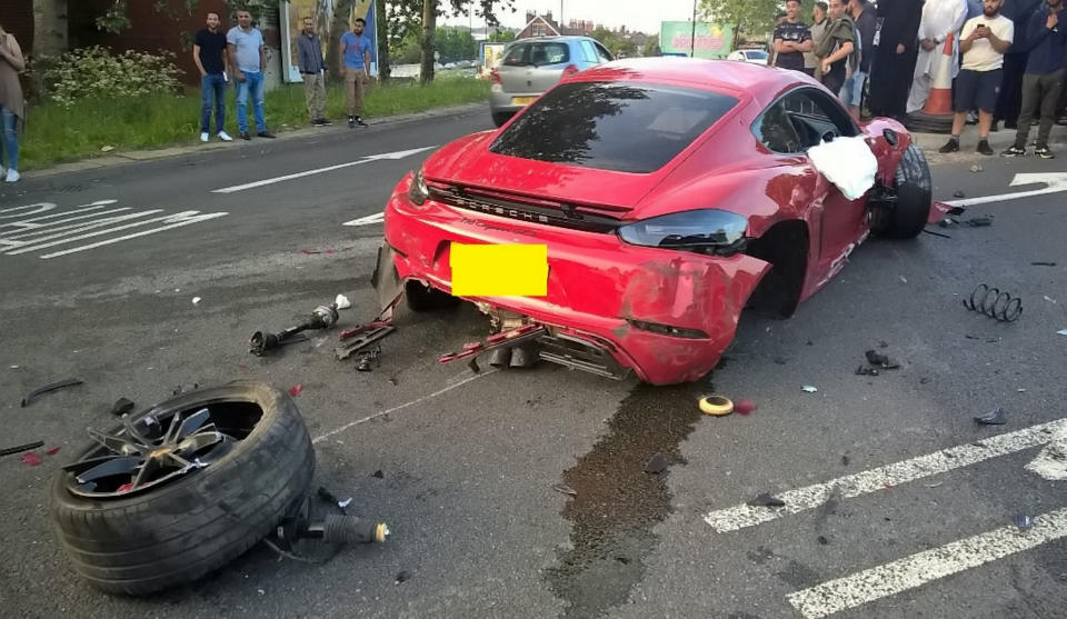 The Porsche's wheel was detached from the car. (SWNS)