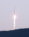 The Nuri rocket, the first domestically produced space rocket, lifts off from a launch pad at the Naro Space Center in Goheung, South Korea, Thursday, Oct. 21, 2021. South Korea test launched its first domestically produced space rocket on Thursday in what officials described as an important step in the country's pursuit of a satellite launch program. (Hong Hae-in/Yonhap via AP)