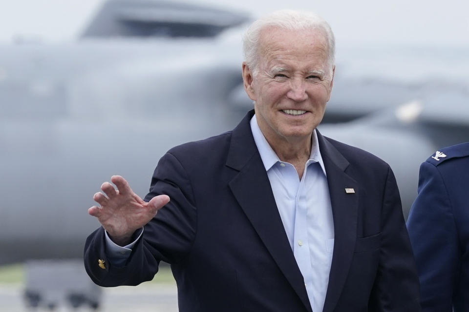 President Joe Biden waves to members of the media as he walks to board Air Force One at Dover Air Force Base in Delaware, Sunday, July 9, 2023. Biden is heading to Europe to meet with King Charles III and attend the NATO Summit. (AP Photo/Susan Walsh)