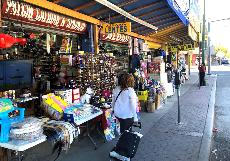 The building at 407 S. Stanton St., at Paisano Drive, in Downtown El Paso, as seen Oct. 16, housing stores selling sunglasses, toys, and other items, is part of a nine-building purchase by a company tied to Dallas' Parking Systems of America.