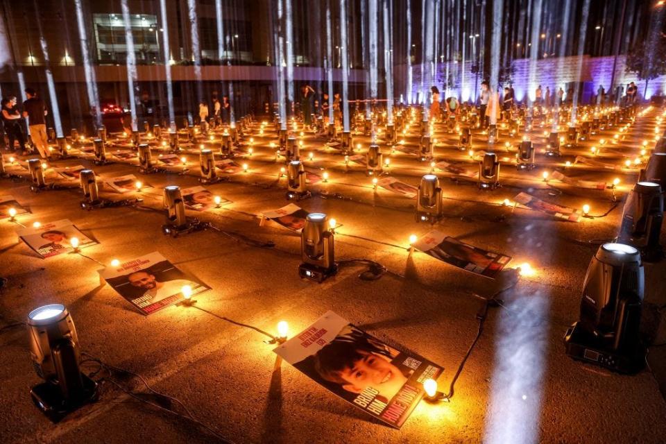 A light installation featuring images of hostages held by Hamas