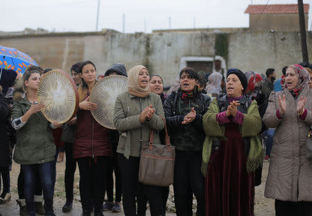 Women chant slogans during a protest near the Syrian-Turkish border in Ras al-Ayn town, Syria December 20, 2018. REUTERS/Rodi Said