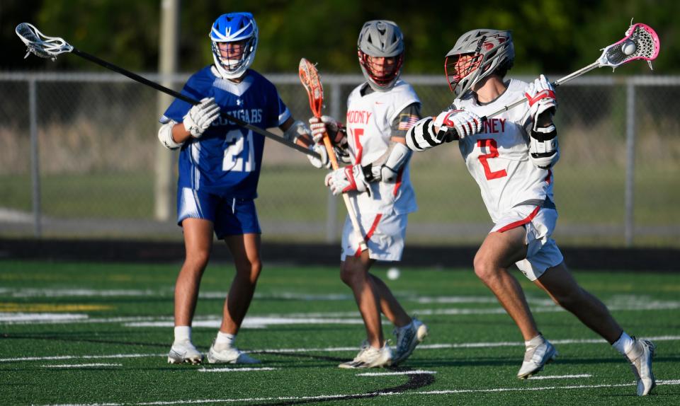 Cardinal Mooney Catholic High's Gio Zanoni (#2) scores a goal against Barron Collier High School during a Varsity Boys Lacrosse playoff game at Austin Smithers Stadium at John Heath Field in Sarasota. Mooney won 15-4.