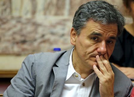 Greek Finance Minister Euclid Tsakalotos attends a session of ruling Syriza's leftist party parliamentary group at the Parliament building in Athens, Greece July 10, 2015. REUTERS/Jean-Paul Pelissier