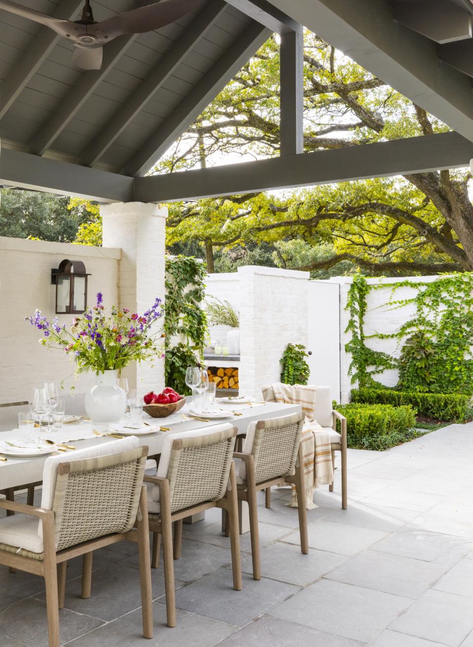 grey wooden gazebo in garden by  Marie Flanigan