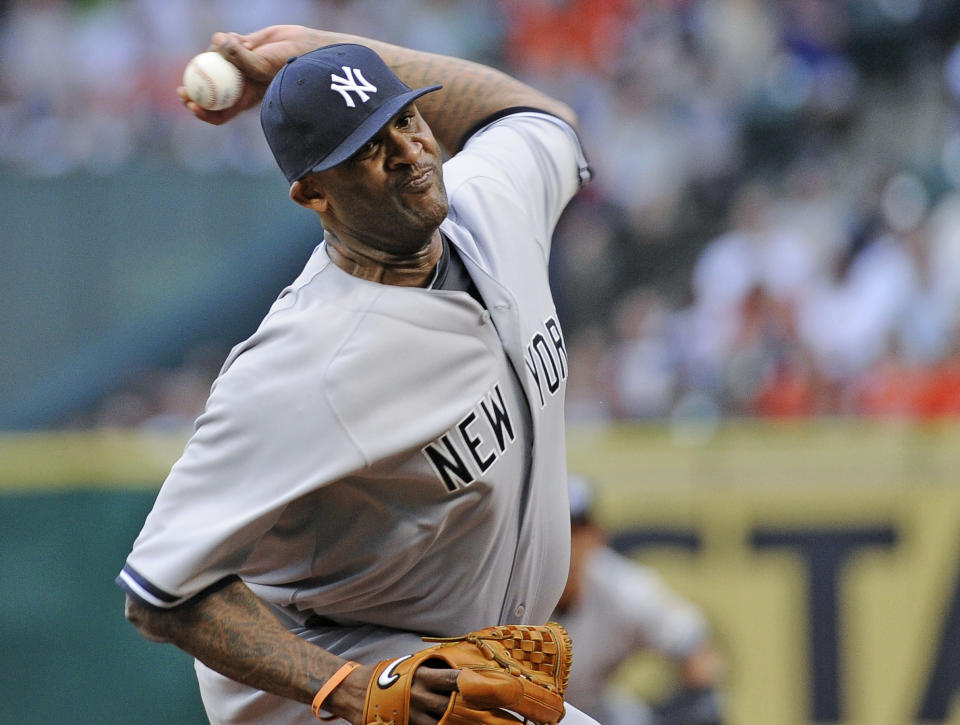 New York Yankees' CC Sabathia delivers a pitch against the Houston Astros in the first inning of a baseball game on opening day for the teams, Tuesday, April 1, 2014, in Houston. (AP Photo/Pat Sullivan)