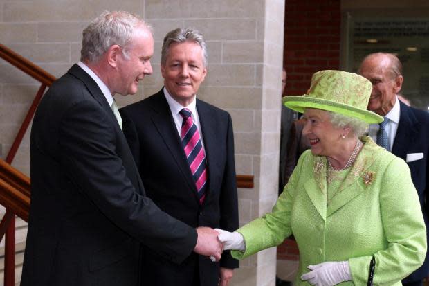Queen Elizabeth shaking hands with Northern Ireland Deputy First Minister Martin McGuinness in Belfast in  2012, symbolic then and now of the need to move away from the evils of the past