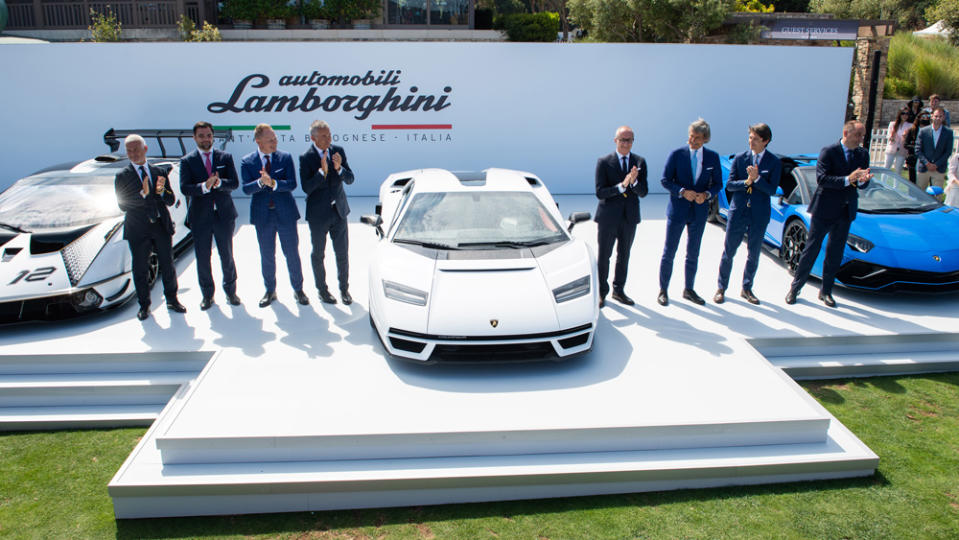 Andrea Baldi (right side, third from car) and members of the Lamborghini executive team reveal the new Countach at the Quail, a Motorsports Gathering last month. - Credit: Photo: Courtesy of Automobili Lamborghini S.p.A.