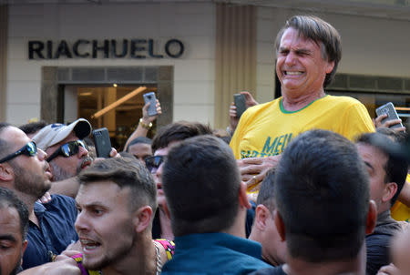 FILE PHOTO: Brazilian presidential candidate Jair Bolsonaro reacts after being stabbed during a rally in Juiz de Fora, Minas Gerais state, Brazil September 6, 2018. Picture taken September 6, 2018. REUTERS/Raysa Campos Leite/File photo