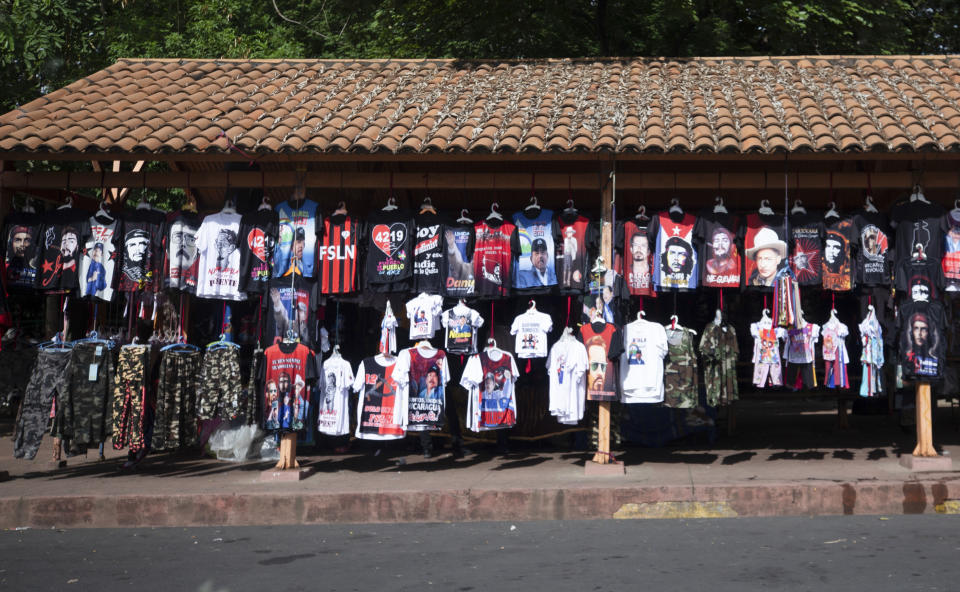 T-shirts featuring the Nicaraguan Revolution are displayed for sale in Managua, Nicaragua, Thursday, June 17, 2021. In recent weeks, President Daniel Ortega's government has rounded up 13 opposition leaders, including four presidential challengers for the Nov. 7 elections. They face allegations ranging from money laundering to crimes against the state. (AP Photo/Miguel Andres)