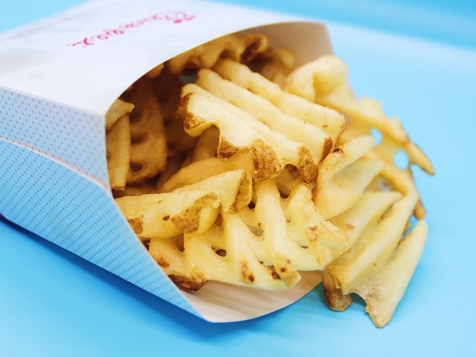 chick fil a waffle fries on blue background