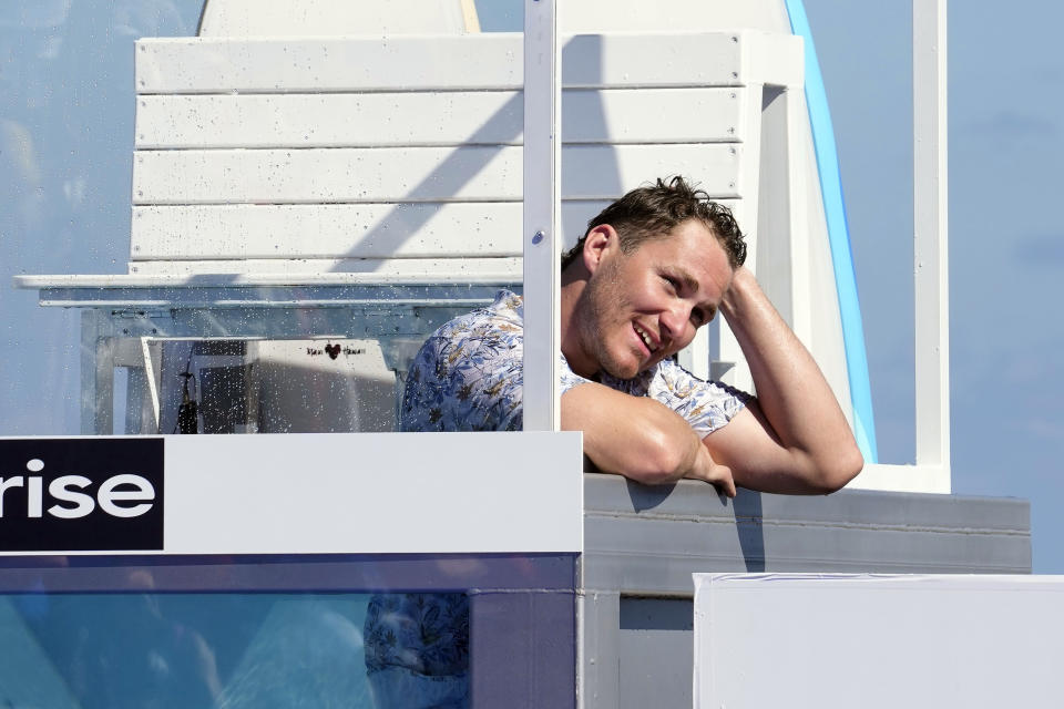 Florida Panthers' Matthew Tkachuk looks to the crowd after he was dunked during al All Star Skills Showcase, Thursday, Feb. 2, 2023, in Fort Lauderdale, Fla. The event is part of the NHL's All Star game events. (AP Photo/Marta Lavandier)