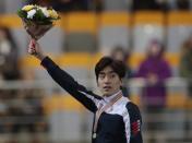 FILE - In this Feb. 14, 2016 file photo, Lee Seung-hoon of South Korea acknowledges the audience with his gold medal after winning the men's mass start race of the speeds kating single distance World Championships in Kolomna, Russia. With the Winter Olympics just a year away, the Asian Winter Games will be the ideal stage for the continent’s leading winter athletes to fine tune for Pyeongchang 2018. The eighth Asian Winter Games will open in Sapporo on Sunday, Feb. 19 and run through Feb. 26, with more than 2,000 athletes from 31 countries competing in five sports, 11 disciplines and 64 events. South Korea, the next Olympic host, will have 142 athletes taking part and has set an ambitious goal of 15 gold medals and second place in the medals standings. Lee, the 2010 Olympic champion in the men's 10,000 meters, is currently the world No. 1 in mass start. (AP Photo/Ivan Sekretarev, File)