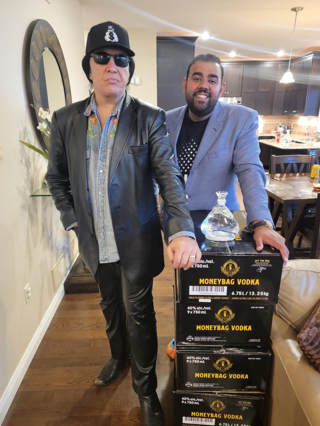 Ravidner Minhas, owner of Monroe's Minhas Brewery and Distillery, poses with Gene Simmons. The two created Simmons' MoneyBag Vodka