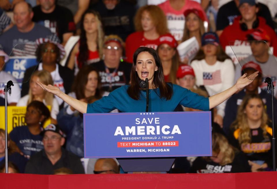 Tudor Dixon, Republican candidate for Governor of Michigan waves to the crowd before her talk to them. Dixon and other politicians took to the stage before former President Donald TrumpÕs speech at the Macomb Community College, Sports and Expo Center in Warren on Saturday, October 1, 2022.