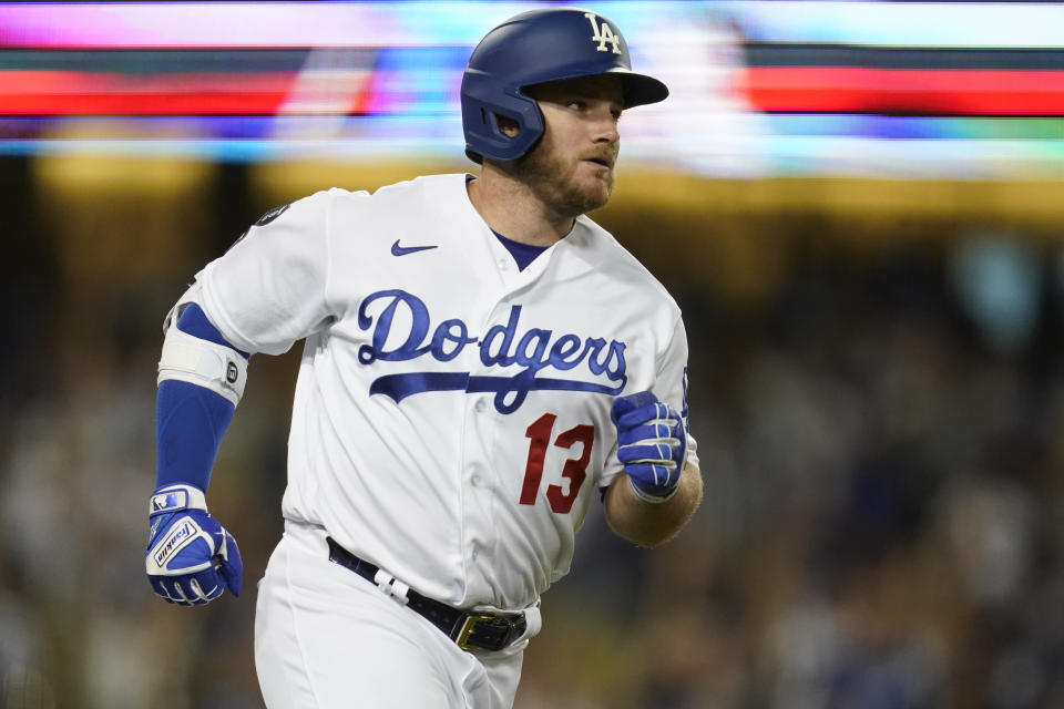 Los Angeles Dodgers' Max Muncy runs the bases after hitting a home run during the third inning of a baseball game against the San Diego Padres Friday, Sept. 10, 2021, in Los Angeles. Mookie Betts also scored. (AP Photo/Ashley Landis)