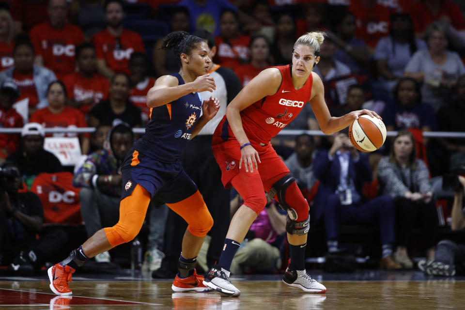 Washington Mystics forward Elena Delle Donne, right, drives against Connecticut Sun forward Alyssa Thomas in the first half of Game 1 of basketball's WNBA Finals, Sunday, Sept. 29, 2019, in Washington. (AP Photo/Patrick Semansky)