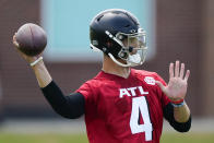 Atlanta Falcons quarterback Desmond Ridder (4) throws a pass during NFL football team's rookie minicamp, Saturday, May 14, 2022, in Flowery Branch, Ga. (AP Photo/John Bazemore)