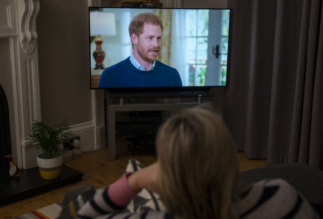 A person at home in Edinburgh watching the Duke of Sussex interview 