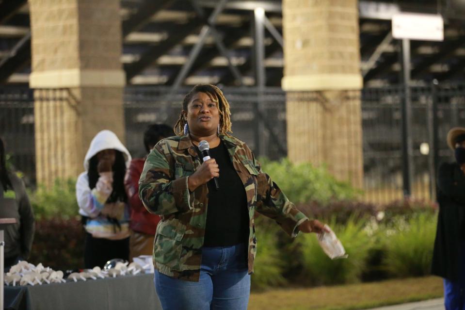 Toni Grant speaks about her experience with gun violence on Tuesday evening during a Stop Gun Violence rally outside Memorial Stadium.