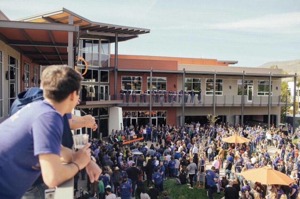 Employees of MindBody celebrate the grand opening of its campus in San Luis Obispo in 2015.