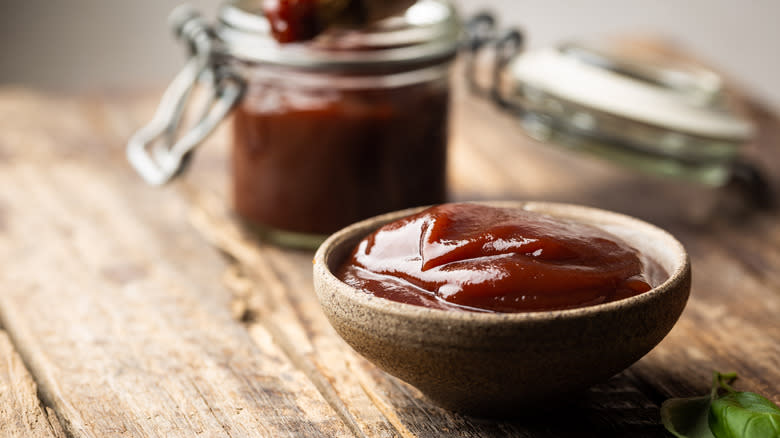 barbecue sauce in bowl on wooden table