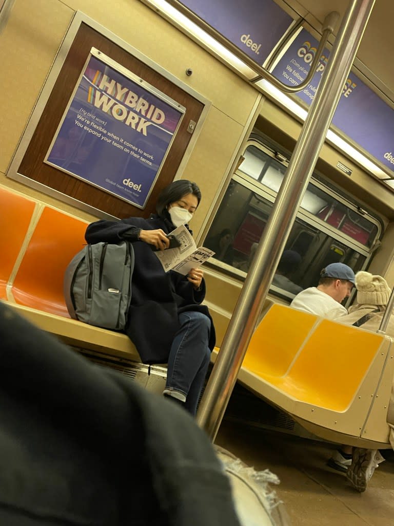 A lucky straphanger reads a copy of Public Transport Magazine they found on the train. Al Mullen