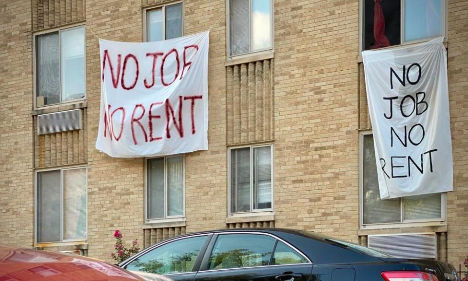 Banners saying 'no job, no rent' are displayed on a building in Washington DC on 9 August.