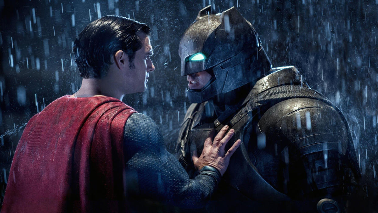  Superman puts his hand on an armored Batman's chest in DC's Batman v Superman film, one of May's new Max movies. 