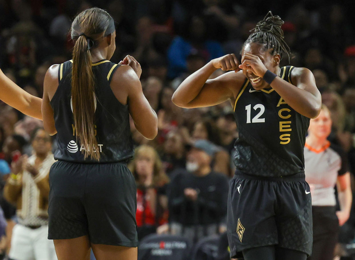Jackie Young, left, and Chelsea Gray of the Las Vegas Aces celebrate during a recent game at Michelob ULTRA Arena in Las Vegas. (Ethan Miller/Getty Images)