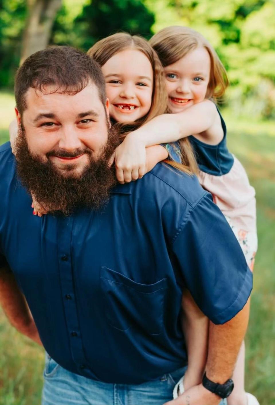 Kerrey Brindle, shown here with daughters Ryleigh and Kylynn, before his death in 2022.