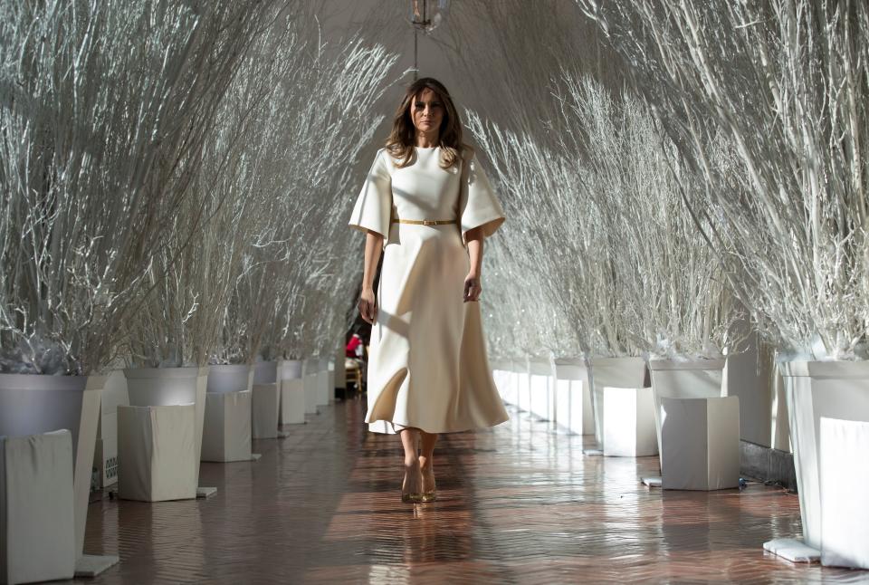 First lady Melania Trump in the East Colonnade decorated in white branches for the 2017 holiday decorations at the White House, Nov. 27, 2017.