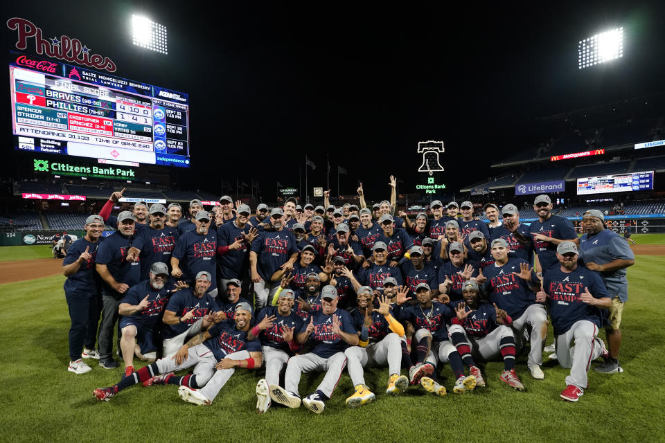 The Atlanta Braves pose for a team photo after clinching their sixth consecutive NL East title by defeating the Philadelphia Phillies in a baseball game, Wednesday, Sept. 13, 2023, in Philadelphia. (AP Photo/Matt Slocum)