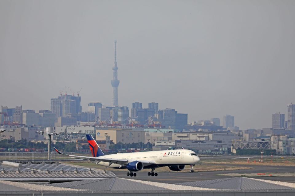 A Delta airplane on the tarmac at Tokyo International Airport, commonly known as Haneda Airport