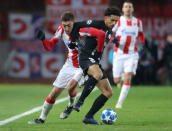 Soccer Football - Champions League - Group Stage - Group C - Crvena Zvezda v Paris St Germain - Rajko Mitic Stadium, Belgrade, Serbia - December 11, 2018 Paris St Germain's Marquinhos in action with Crvena Zvezda's Milan Pavkov REUTERS/Marko Djurica