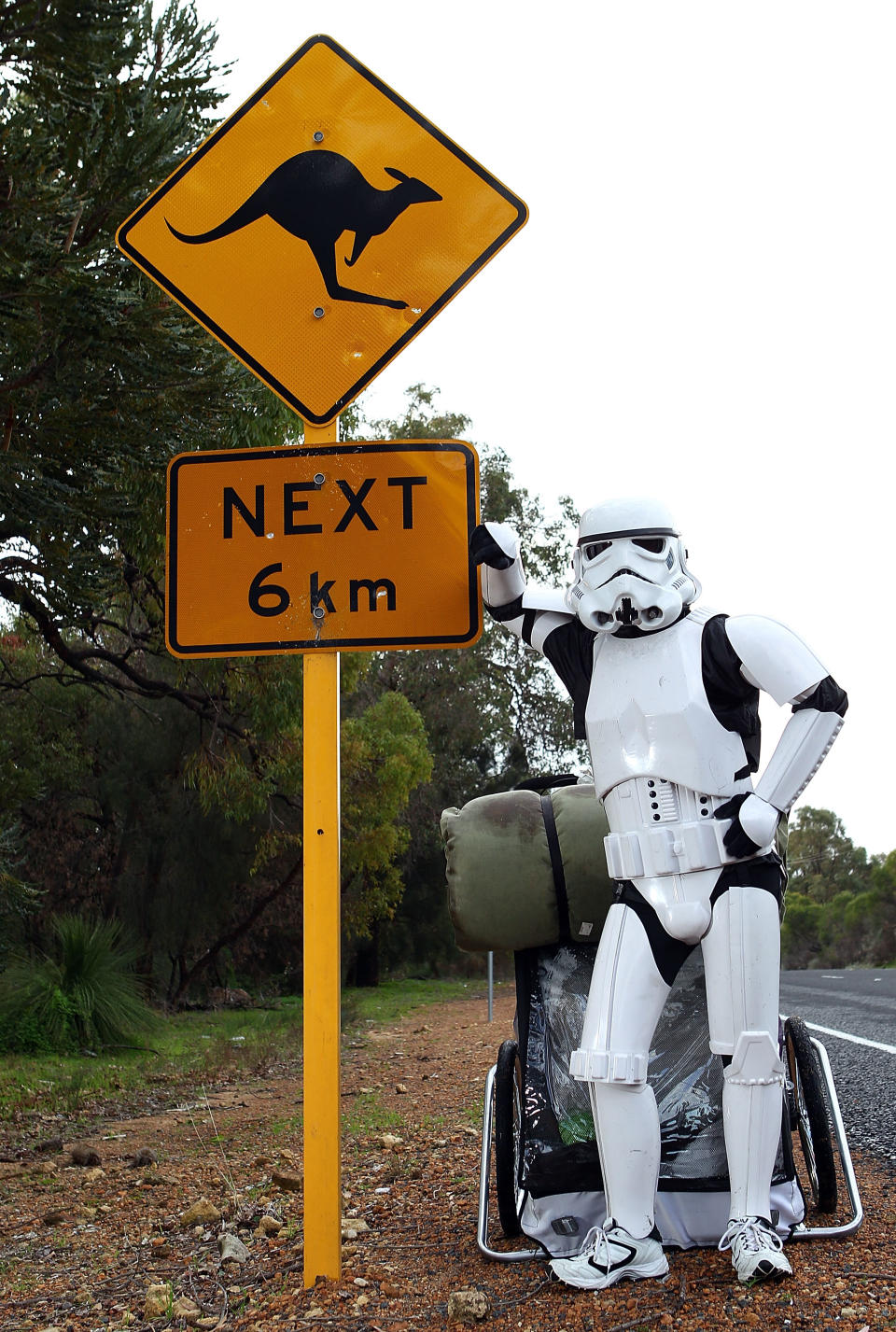 PERTH, AUSTRALIA - JULY 15: Stormtrooper Paul French is pictured on day 5 of his over 4,000 kilometre journey from Perth to Sydney taking a rest break on Old Mandurah Road on July 15, 2011 in Perth, Australia. French aims to walk 35-40 kilometres a day, 5 days a week, in full Stormtrooper costume until he reaches Sydney. French is walking to raise money for the Starlight Foundation - an organisation that aims to brighten the lives of ill and hostpitalised children in Australia. (Photo by Paul Kane/Getty Images)