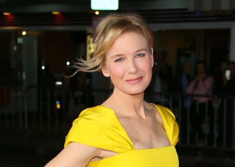 Renée Zellweger made a rare red carpet appearance in a Belle-yellow dress