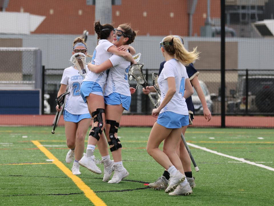 West Morris seniors Kaitlyn Cronin and Morgen Albanese celebrate a goal during a NJGILL Freedom North girls lacrosse game against Roxbury on April 5.