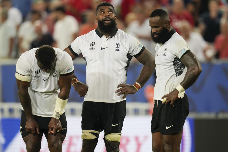 Fiji's players react at the end of the Rugby World Cup Pool C match between Wales and Fiji at the Stade de Bordeaux in Bordeaux, France, Sunday, Sept. 10, 2023. (AP Photo/Themba Hadebe)